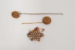 Gold-coloured miniature tortoise brooch set seedpearls and having cabochon pink hardstone eyes, a