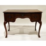 20th century walnut dressing table, the rectangular top with applied moulded edge, three drawers, on