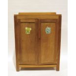 20th century oak cabinet, the rectangular top above two cupboard doors enclosing shelves, 76cm x