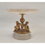 Small marble tazza with gilt cherub supports (chipped) 13cm high, 14.5cm dia. Condition ReportApprox