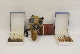 WWII gas mask and a set of knives and forks with antler handles