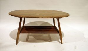 Ercol oval coffee table with elm top and beech supports, rack under, 99cm wide Condition Report Some