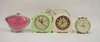 Smiths Sectric repeater clock, a Junghans Bivox alarm clock, another Smiths Sectric alarm clock