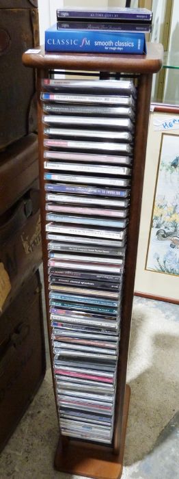 A quantity of Classical CDs to include Mozart, Grieg etc along with a Modern Wooden CD tower.