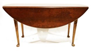 20th century mahogany drop-leaf table on turned supports to pad feet, 152cm