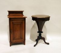 Victorian mahogany octagonal work table on faceted trumpet-shaped and turned pedestal to three