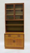 Mid-century modern teak G-Plan lounge display cabinet with two glazed doors enclosing shelves