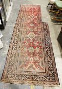 Persian runner with pink ground foliate field, stepped border, approx. 350cm x 105cm