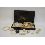 Assorted mother-of-pearl Chinese game counters including some in form of fish, ivory cross, bangles,