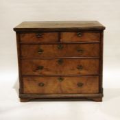 Early Georgian oak and walnut chest of two short over three long drawers, the rectangular oak top