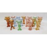 Collection of Art Deco press-moulded glass Rocket vases, in blue, green, amber and pink