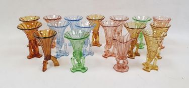 Collection of Art Deco press-moulded glass Rocket vases, in blue, green, amber and pink