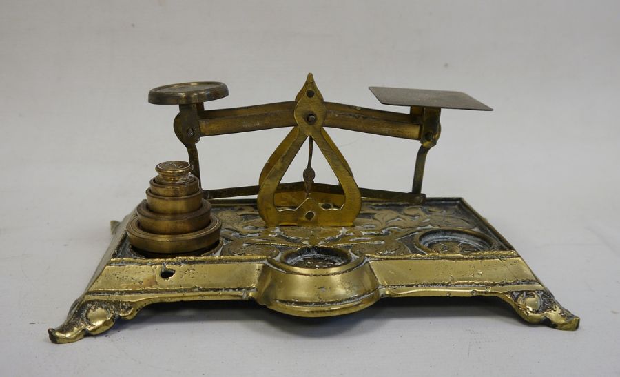 Set of brass scales with relief scrollwork and floral decoration