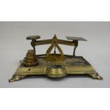 Set of brass scales with relief scrollwork and floral decoration