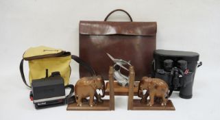Aluminium model of a spitfire, a pair of carved hardwood elephant bookends, a pair of Swift Grand