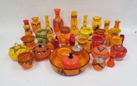 Collection of Czechoslovakian and Bohemian tango glass and other coloured glassware in yellow,