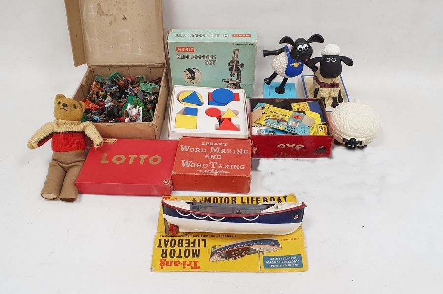 Assorted items to include Merit microscope set, plastic cowboys and indians, Shaun the Sheep