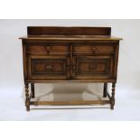 Early 20th century oak sideboard with two drawers and two cupboard doors, on barleytwist and block
