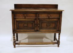 Early 20th century oak sideboard with two drawers and two cupboard doors, on barleytwist and block