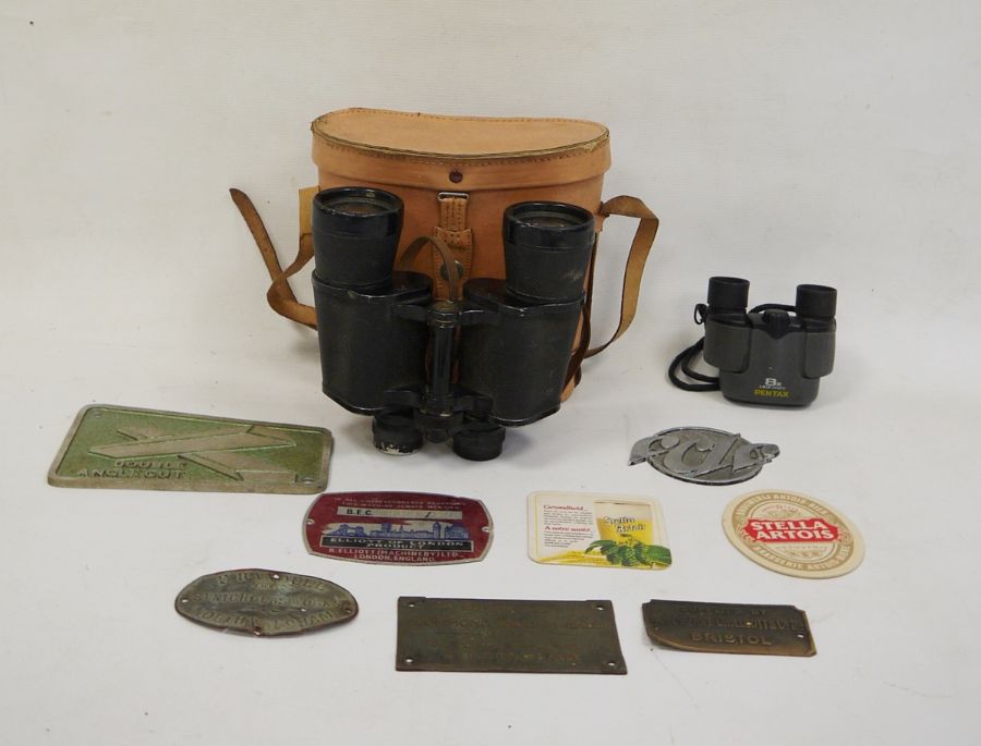 Pair of 12x50 field binoculars in case, a pair of modern Pentax binoculars and various plaques to