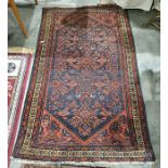 Persian rug, blue ground field with red ground decoration, stepped border, 192cm x 113cm