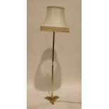 Modern brass standard lamp on triform base