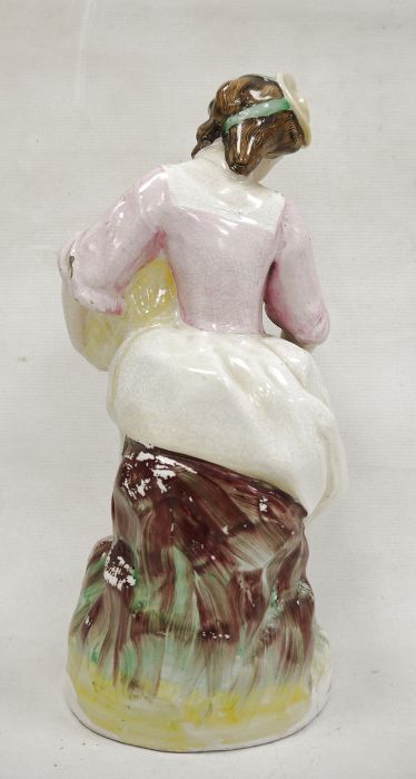 Staffordshire pottery figure of a lady vintner, late 19th century, she modelled seated holding a - Bild 3 aus 5