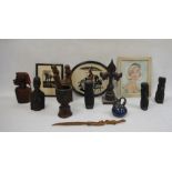 Collection of African carved wooden figures and heads, a cast iron fleur-de-lis, a cut paper