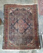 Persian carpet, white ground central field with pink ground central motif, the field florally