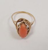 14K gold and coral ring set torpedo-pattern coral, on open wirework surround