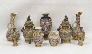 A collection of Japanese pottery vases, early 20th century, each decorated in raised enamels with