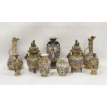 A collection of Japanese pottery vases, early 20th century, each decorated in raised enamels with