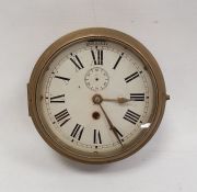 Ship's type clock with circular dial and Roman numerals, subsidiary seconds dial, in brass casing