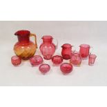 Collection of late Victorian and Edwardian cranberry glass including four jugs in sizes, one with