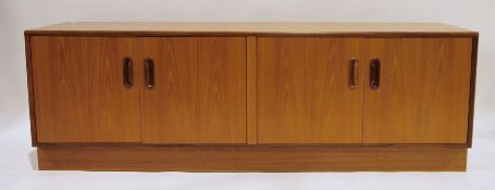 Low G-Plan teak sideboard with four cupboard doors, on plinth base, 162cm x 54cm