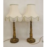Pair of cast gilt metal table lamps with naturalistic leaf decoration to column and base, approx
