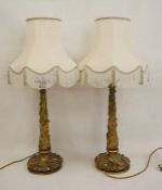 Pair of cast gilt metal table lamps with naturalistic leaf decoration to column and base, approx