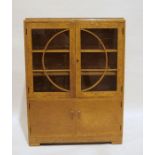 20th century Art Deco cabinet by Denby & Spinks Ltd, in burr maple, with glazed doors enclosing