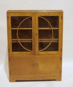 20th century Art Deco cabinet by Denby & Spinks Ltd, in burr maple, with glazed doors enclosing