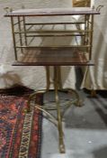 Victorian brass and mahogany periodical stand, the rectangular top with carved edge, brass finials