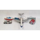 Collection of vintage toys including BOAC plane, battery operated police car and vintage hand