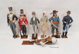 Various carved wooden and painted models of figures including man in uniform, etc. Between 42cm -