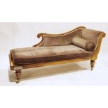Victorian chaise longue on turned and carved supports to brass caps and castors, upholstered in pale