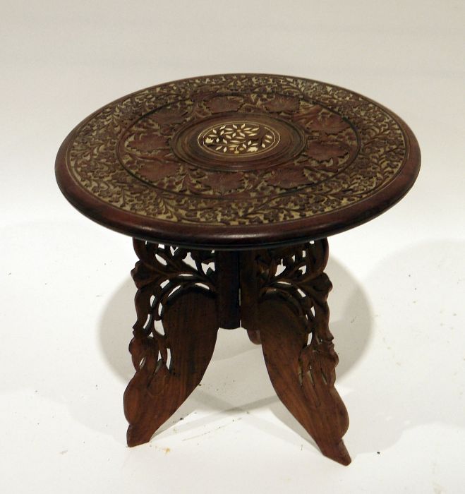 Eastern carved coffee table with bone inlay and folding carved base, 38cm diameter - Image 2 of 2