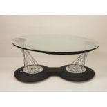 Modern designer coffee table, the circular top with swivelling out to reveal second swivelling