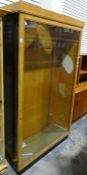 Oak and glazed shop display cabinet on plinth base, 112cm x 193cm