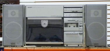 Sharp VZ3500E record and tape player with speakersCondition ReportSome surface scratches, scuff