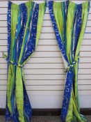 Pair of green, lime and blue striped curtains with gold coloured decoration, roman blind and tie