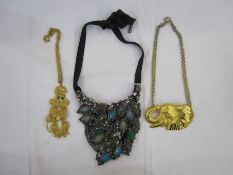 Modern large gilt metal elephant head necklace marked 'DR 94' and a gilt metal articulated poodle