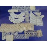 Quantity of lace , crocheted, trimmings collars, a lace fichu etc.